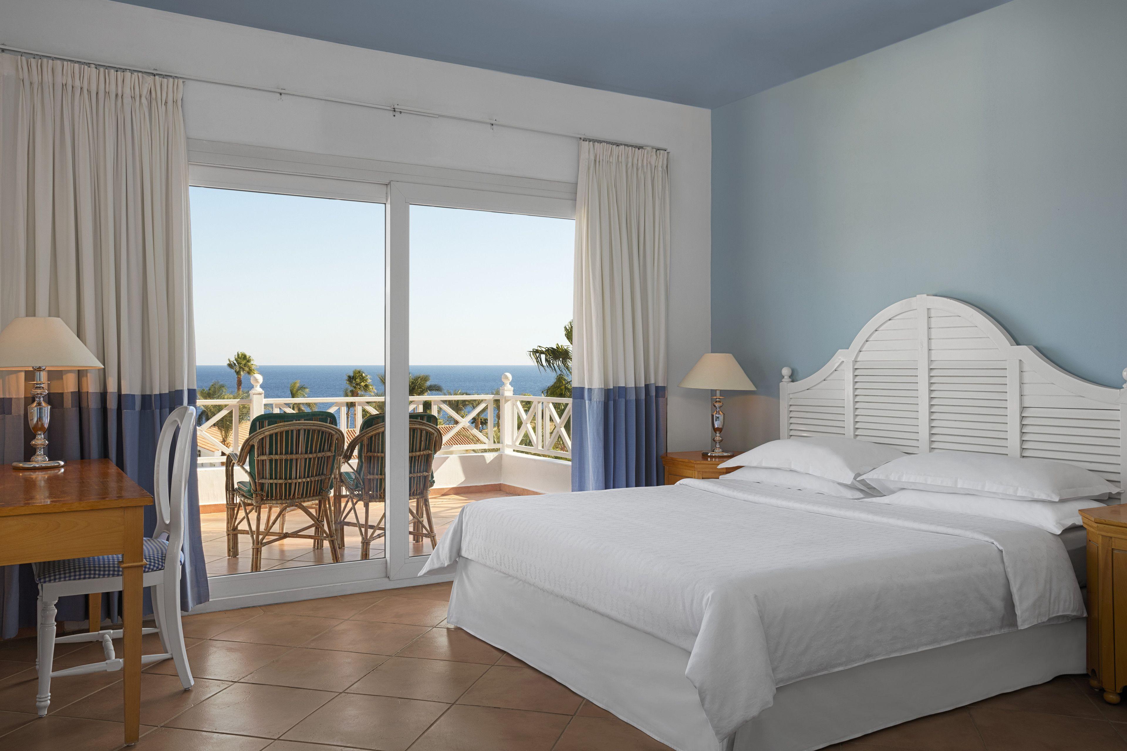 Two-Bedroom Family Room Two Single Beds One King Bed Private Terrace Garden View Lower Level